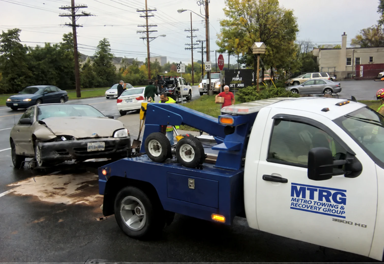 MTRG tow truck assisting at a collision scene