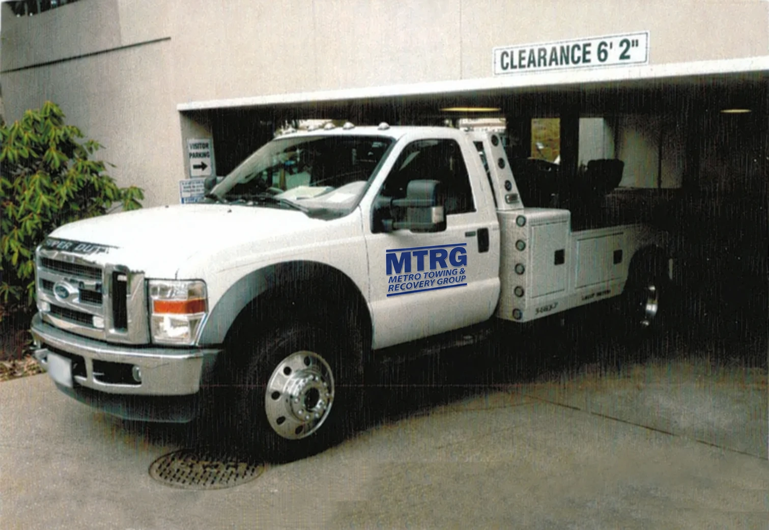 MTRG tow truck at a low-clearance parking garage