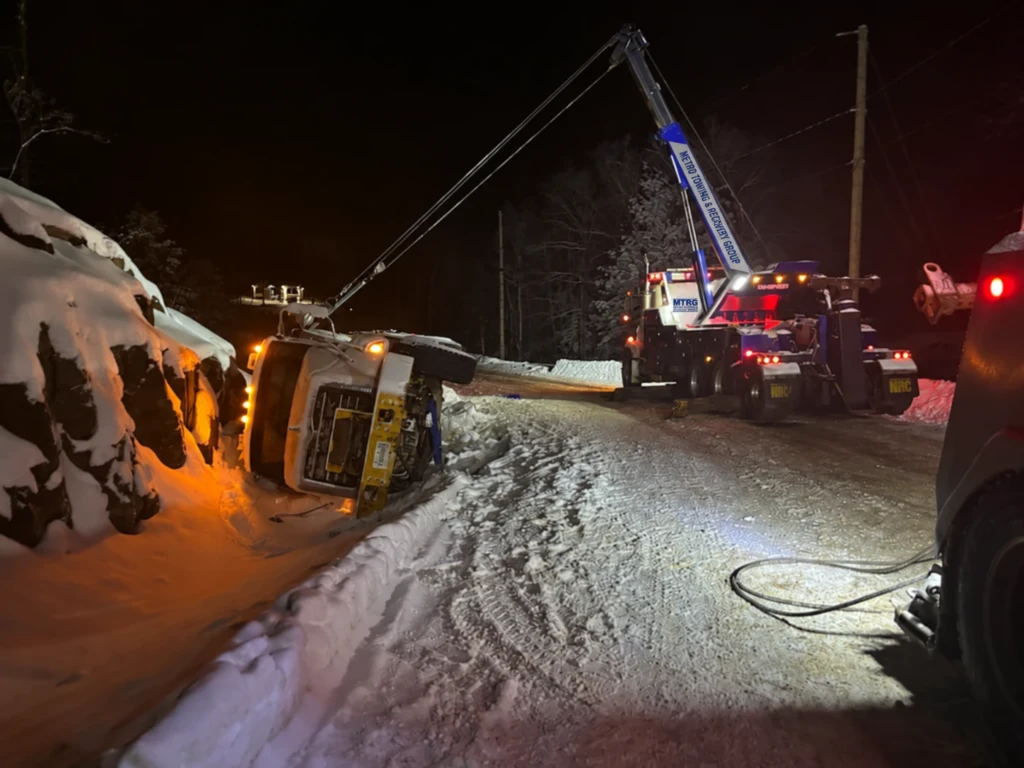 MTRG rotator recovering an overturned concrete truck at night